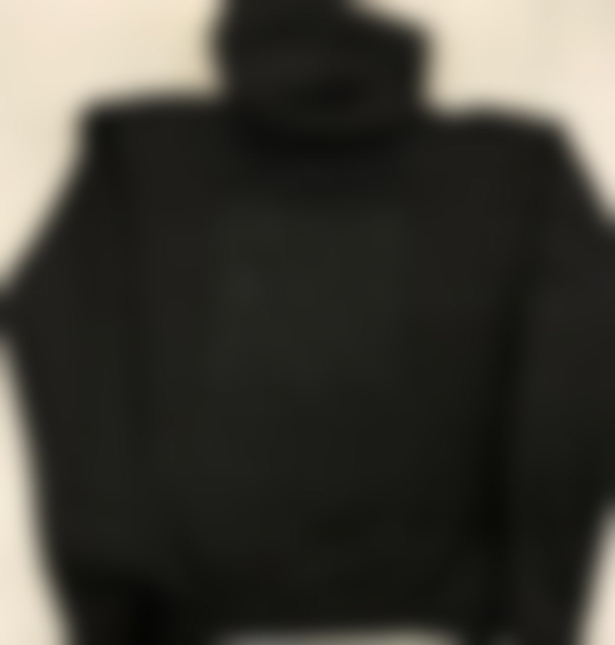 Blurred teaser of the upcoming OFFTHECOURT hoodie in black