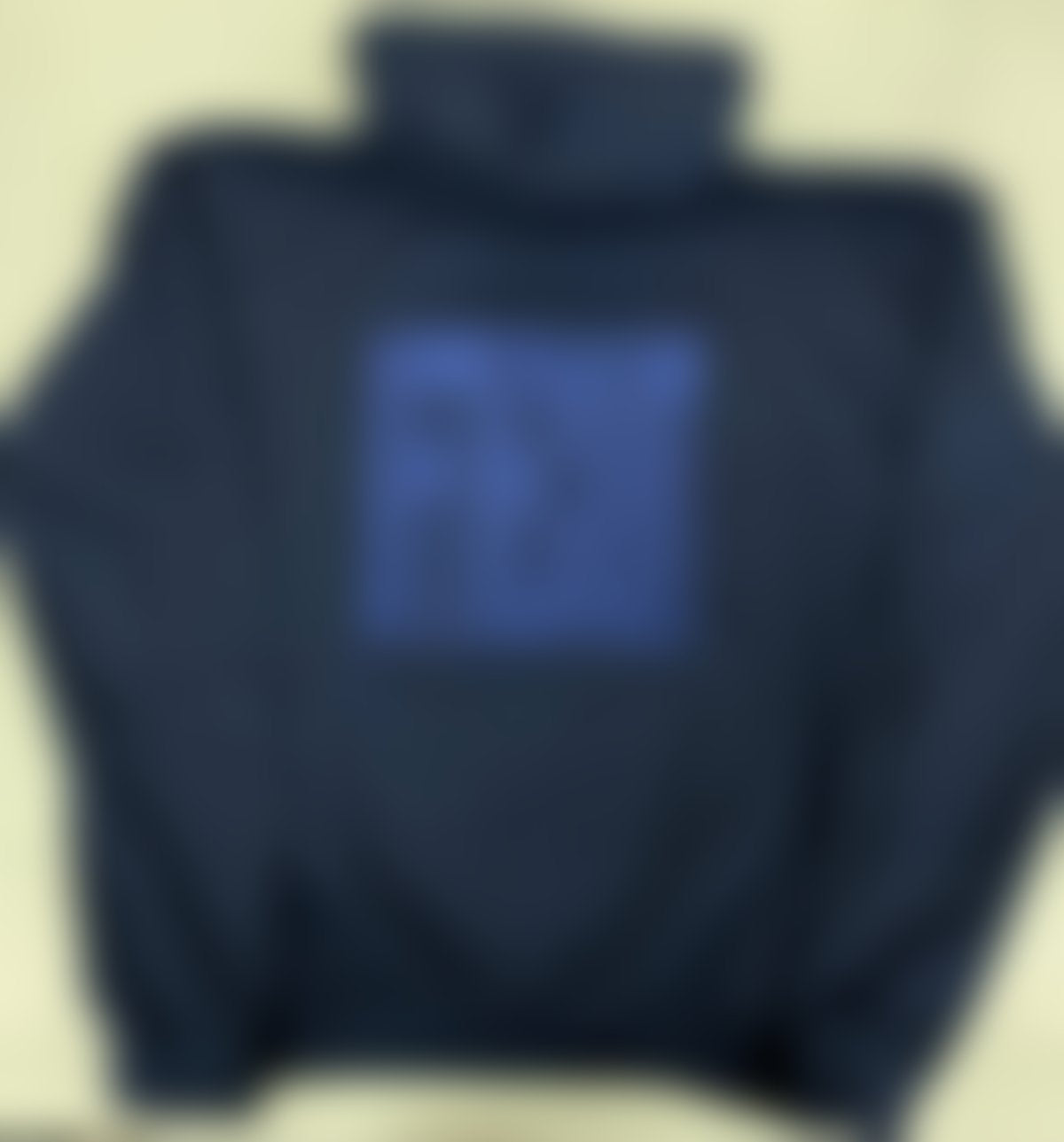 Blurred teaser of the upcoming OFFTHECOURT hoodie in navy